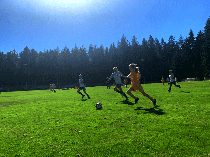 girl playing soccer